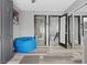 Bright bedroom features a modern closet, full length mirror, and adjacent bathroom at 6925 Emerald Springs Ln, Las Vegas, NV 89113