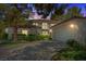 Charming two-story home with a tile roof, well-maintained landscaping, and attached two-car garage at 6925 Emerald Springs Ln, Las Vegas, NV 89113