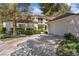 Charming home exterior with a well-maintained yard and two-car garage at 6925 Emerald Springs Ln, Las Vegas, NV 89113