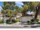 Charming two-story home with a tile roof, well-maintained landscaping, and attached two-car garage at 6925 Emerald Springs Ln, Las Vegas, NV 89113