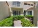 Charming front yard with manicured hedges and a glimpse of the home's exterior at 6925 Emerald Springs Ln, Las Vegas, NV 89113