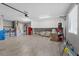 Spacious garage with storage cabinets, washer, dryer, utility sink, and room for a workout area with punching bag at 6925 Emerald Springs Ln, Las Vegas, NV 89113