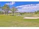Expansive golf course view with manicured green and sand trap, set against a clear blue sky at 6925 Emerald Springs Ln, Las Vegas, NV 89113