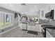 Modern kitchen featuring stainless appliances, stone countertops and an open floorplan at 6925 Emerald Springs Ln, Las Vegas, NV 89113