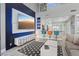 Open-concept living room featuring high ceilings, modern media center, and stylish decor at 6925 Emerald Springs Ln, Las Vegas, NV 89113