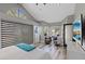 Bright main bedroom features high ceilings, light walls, and views through the windows at 6925 Emerald Springs Ln, Las Vegas, NV 89113