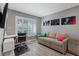 Comfortable office space with a modern desk and a pull-out sofa for guests at 6925 Emerald Springs Ln, Las Vegas, NV 89113