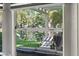 Relax on the patio with beautiful views of the backyard and pond at 6925 Emerald Springs Ln, Las Vegas, NV 89113