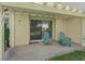 Cozy covered patio with two Adirondack chairs offers a relaxing spot to enjoy the outdoors at 6925 Emerald Springs Ln, Las Vegas, NV 89113