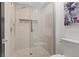 Contemporary walk-in shower with glass door, shower head and built in niche at 6925 Emerald Springs Ln, Las Vegas, NV 89113