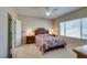 Comfortable bedroom with a ceiling fan, natural light, and a well-maintained interior at 7649 Broadwing Dr, North Las Vegas, NV 89084