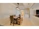Dining area featuring contemporary lighting, tile floors, and easy access to other rooms at 7649 Broadwing Dr, North Las Vegas, NV 89084