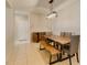 Bright dining area with tile floors, casual dining set, and modern lighting at 7649 Broadwing Dr, North Las Vegas, NV 89084