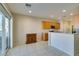 Bright kitchen boasts tile flooring, wood cabinetry, and a sliding glass door to the backyard at 7649 Broadwing Dr, North Las Vegas, NV 89084