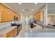 Modern kitchen features stainless steel appliances, light wood cabinets and countertops with a neutral backsplash at 7649 Broadwing Dr, North Las Vegas, NV 89084