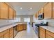 Kitchen features stainless steel appliances, ample countertop space, and light wood cabinets at 7649 Broadwing Dr, North Las Vegas, NV 89084