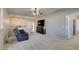 Comfortable living space with an entertainment center, a ceiling fan, and ample natural light at 7649 Broadwing Dr, North Las Vegas, NV 89084