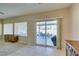 Living room featuring sliding glass doors to the backyard patio and neutral tones at 7649 Broadwing Dr, North Las Vegas, NV 89084