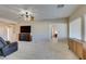 Bright, open living room featuring a ceiling fan, and seamless transition to other living spaces at 7649 Broadwing Dr, North Las Vegas, NV 89084