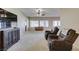Comfortable living room with recliners, a media center, and a ceiling fan for added comfort at 7649 Broadwing Dr, North Las Vegas, NV 89084