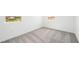 Carpeted bedroom with a neighborhood view from the window, and bright white walls at 77 Tardando Ave, Henderson, NV 89015