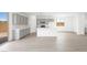 Modern kitchen featuring white countertops, light gray cabinets, and stainless steel appliances at 77 Tardando Ave, Henderson, NV 89015