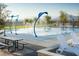 Community splash pad with playful water features, benches, and a picnic table at 77 Tardando St, Henderson, NV 89015