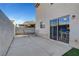 Cozy backyard patio with sliding glass door access to the home's interior at 7721 Sour Gum Ct, Las Vegas, NV 89131