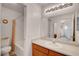 Bathroom featuring a single vanity, wood cabinets, and a shower/tub combo at 7721 Sour Gum Ct, Las Vegas, NV 89131