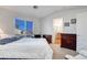 Spacious bedroom featuring a large window, dresser, and access to the en-suite bathroom at 7721 Sour Gum Ct, Las Vegas, NV 89131
