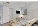 Bedroom featuring a queen-size bed, a wardrobe, and a window with blinds at 7721 Sour Gum Ct, Las Vegas, NV 89131