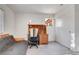 Bedroom featuring a futon, a desk, and a window with blinds at 7721 Sour Gum Ct, Las Vegas, NV 89131