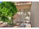 A secure front entryway with a decorative security door, complemented by lush greenery at 7721 Sour Gum Ct, Las Vegas, NV 89131
