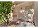 Protected entryway featuring security door and sturdy columns, surrounded by decorative gravel and vegetation at 7721 Sour Gum Ct, Las Vegas, NV 89131