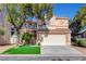 Charming two-story home with a well-maintained front yard and attached two-car garage at 7721 Sour Gum Ct, Las Vegas, NV 89131