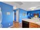 Interior view shows the flow from the kitchen area to the dining nook and living space at 7721 Sour Gum Ct, Las Vegas, NV 89131