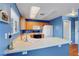 Bright kitchen boasts wood cabinets, modern appliances, and a practical layout at 7721 Sour Gum Ct, Las Vegas, NV 89131