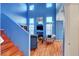 Bright living space with high ceilings, wood floors, and an abundance of natural light at 7721 Sour Gum Ct, Las Vegas, NV 89131