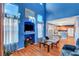 Inviting living room with tall ceilings, hardwood floors, and open to the kitchen area at 7721 Sour Gum Ct, Las Vegas, NV 89131