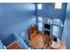 Aerial view of open living space with tall ceilings, hardwood floors, and plenty of natural light at 7721 Sour Gum Ct, Las Vegas, NV 89131