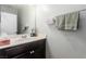 Clean bathroom featuring a vanity with sink, a mirror, and neutral wall color at 7769 Peaceful Trellis Dr, Las Vegas, NV 89179