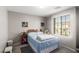 Cozy bedroom with a large window and soft natural lighting at 7769 Peaceful Trellis Dr, Las Vegas, NV 89179