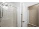 Clean bathroom design with glass door shower stall and neutral color palette at 7916 Nesting Pine Pl, Las Vegas, NV 89143