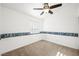 Bedroom featuring a ceiling fan, wallpaper, and carpet flooring at 7916 Nesting Pine Pl, Las Vegas, NV 89143