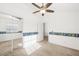 Carpeted bedroom with sliding closet doors and a ceiling fan at 7916 Nesting Pine Pl, Las Vegas, NV 89143