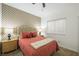 Cozy bedroom with floral wallpaper, carpeted floors, and large window at 7916 Nesting Pine Pl, Las Vegas, NV 89143