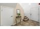 Inviting entryway with tile flooring, staircase, and decorative table with plant at 7916 Nesting Pine Pl, Las Vegas, NV 89143
