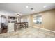 Bright and airy living room boasts a fireplace, ceiling fan, and neutral color palette at 7916 Nesting Pine Pl, Las Vegas, NV 89143