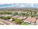 Expansive aerial view of a well-planned community with lush landscaping and stunning mountain views at 8316 Imperial Lakes St, Las Vegas, NV 89131