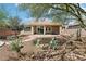 Backyard featuring desert landscaping and a covered patio for relaxing outdoor living at 8316 Imperial Lakes St, Las Vegas, NV 89131